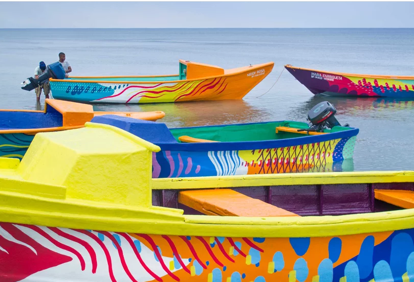 52 rusty fishing boats painted to preserve marine biodiversity